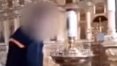 SKANDALOZNO PONAŠANJE U PRAVOSLAVNOM HRAMU: Snimao se dok je palio cigaru o sveću, sada ga čeka robija - a evo šta kaže vladika (VIDEO)
