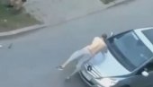 JOŠ JEDAN ŠOKANTAN SNIMAK IZ NOVOG SADA: Muškarac skače na automobil, uništava inventar - a zatim urinira! (VIDEO)