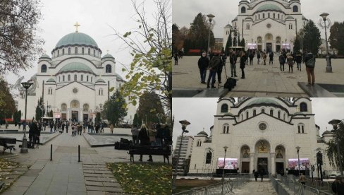 SAOBRAĆAJ OKO HRAMA SVETOG SAVE OBUSTAVLJEN: Na ulasku u hram stoje pripadnici garde Vojske Srbije, a vernici pale sveće