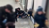 DRAMATIČAN SNIMAK: Policija obara oca na zemlju jer nema masku, dete stoji pored i vrišti (VIDEO)