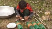 СНИМАК ПОСТАО ВИРАЛАН: Дечак смислио нову, генијалну технику пецања (ВИДЕО)