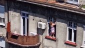 BEOGRAĐANI U ČUDU: Žena odlučila da opere prozore, pa ostavila sugrađane bez teksta (VIDEO)