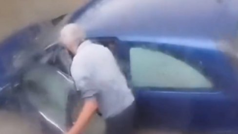 BAKA I DEKA ZAGLAVLJENI U NOVOM SADU: Očajnički pokušavaju da pomere automobil koji guta voda (VIDEO)