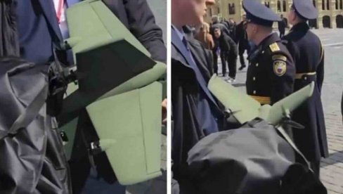 ПУТИН ИМА НОВО ОРУЖЈЕ! Први телохранитељ руског председника снимљен како носи мистериозно футуристичко оружје (ВИДЕО)