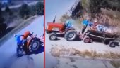 (ŠOK VIDEO) Auto PREPOLOVIO traktor - onda se desilo ČUDO! Uključivao se sa zemljanog puta, a kola su ga presekla - vozilo, ne i vozača