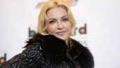 МАДОНА УШЛА У ИСТОРИЈУ: Објавила нови албум, па стала раме уз раме са Битлсима